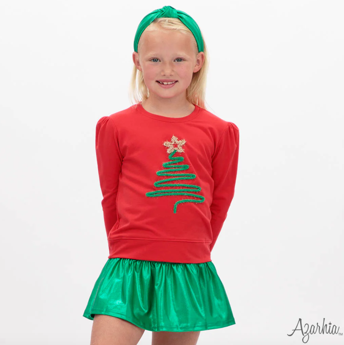 Christmas Tree in Tinsel on Red
